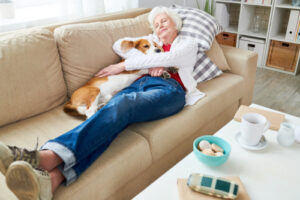 Woman snuggling dog