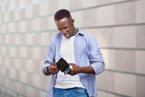 Man looking in wallet