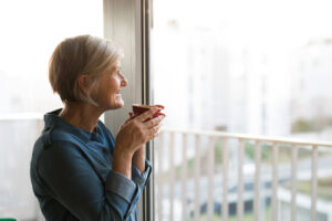 Senior looking out the window