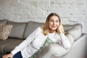 Woman on couch smiling